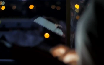 Stock Footage Typing On A Tablet By The Window