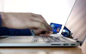 Stock Footage Typing Credit Card Information On A Laptop