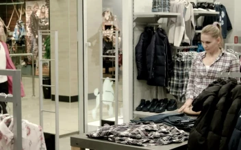 Stock Footage Two Young Women Shopping In A Clothing Store