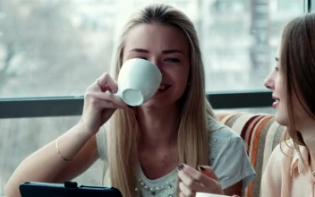 Stock Footage Two Young Woman Laughing In The Coffee Shop