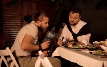 Stock Footage Two Young Men Talking At A Dinner Party