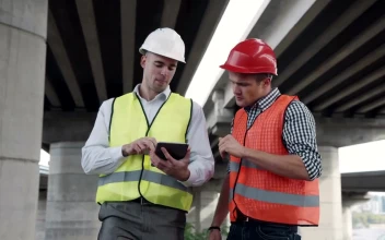 Stock Footage Two Workers Discussing Project Outdoors