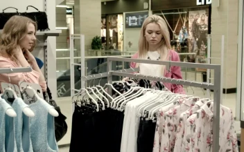 Stock Footage Two Woman Picking Dresses In The Clothing Store