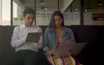 Stock Footage Two People Working On Electronic Devices