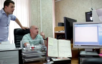 Stock Footage Two Men Working In A Small Office