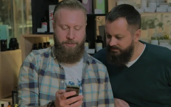 Stock Footage Two Men With Beards Checking A Phone