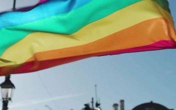 Stock Footage Two Men Holding Up A Rainbow Flag