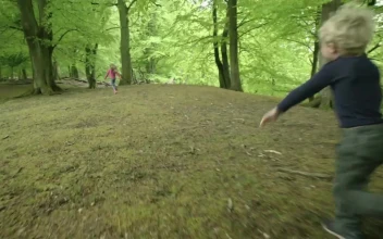 Stock Footage Two Kids Running From Wild Deer