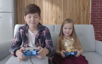 Stock Footage Two Kids Play Console Games And Celebrate Win