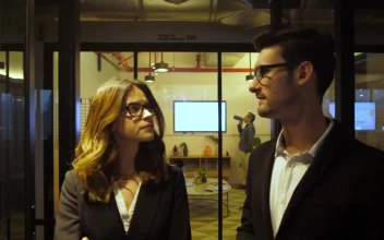 Stock Footage Two Business People Walk In An Office Hall