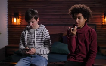 Stock Footage Two Boys Using Their Phones
