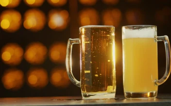 Stock Footage Two Beers Against An Orange Background