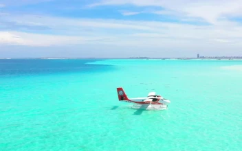 Stock Footage Turquoise Sea With A Plane Floating