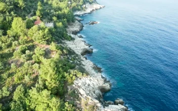 Stock Footage Turquoise Ocean And Steep Rocks