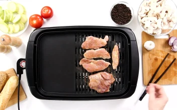 Stock Footage Turning Pork Chops On A Small Grill