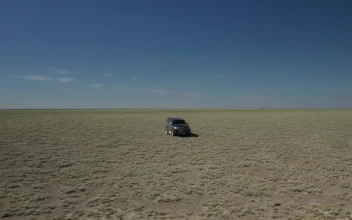Stock Footage Truck Heading Through Dusty Terrain