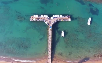 Stock Footage Tropical Pier With Umbrellas And Boats