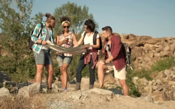 Stock Footage Travelers Watching The Map In The Wild