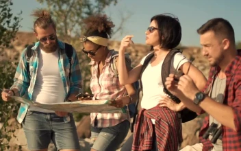 Stock Footage Travelers Looking At The Map In The Wilderness