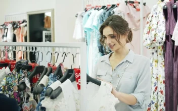 Stock Footage Woman Choosing Clothes In A Store