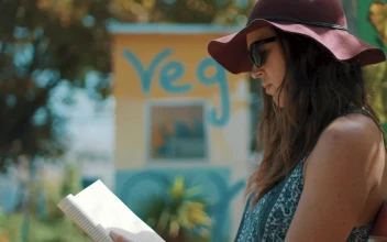 Stock Footage Young Woman Reading A Book On A Sunny Day Free