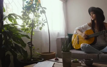 Stock Footage Woman Playing An Acoustic Guitar In Her Living Room Free