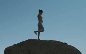 Stock Footage Woman Doing Yoga On A Boulder Free