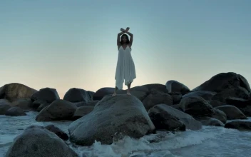 Stock Footage Woman Standing On Big Rocks Near The Water Free