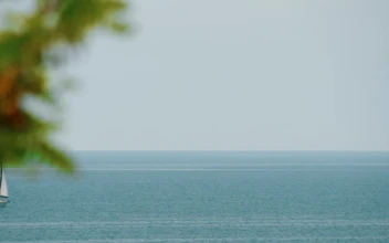 Stock Footage Yacht Heading Across A Calm Sea Free