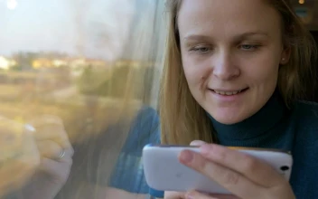 Stock Footage Woman Smiles As She Checks Her Messages Free