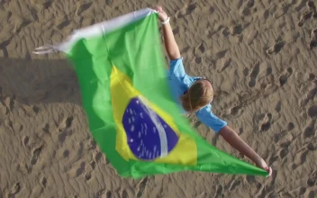 Stock Footage Woman Holding The Brazilian Flag In The Wind Free