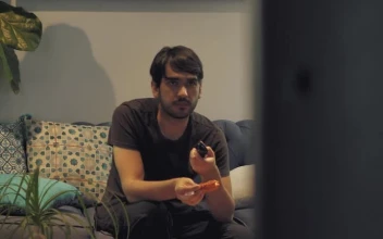 Stock Footage Young Man Watching Television While Eating Free