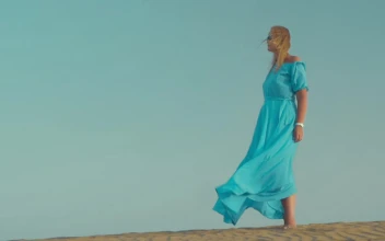 Stock Footage Woman Standing Still In A Blue Dress Free
