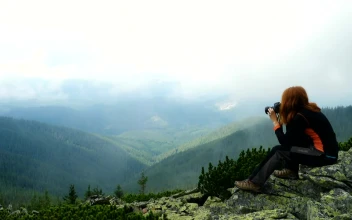 Stock Footage Woman Taking Photos In The Top Of The Mountain Free