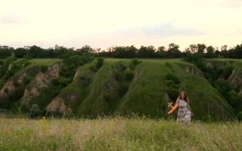 Stock Footage Woman Throwing A Toy Airplane In The Hill Free