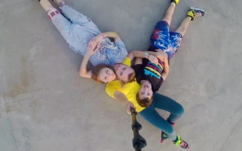Stock Footage Young Family In Rollerskates Laying On The Ground Free