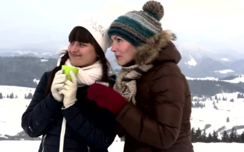 Stock Footage Woman Having Tea In The Top Of A Snowy Mountain Free