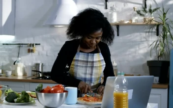 Stock Footage Woman Prepares Food Following A Tutorial Free