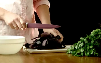 Stock Footage Woman Cutting Herbs In The Kitchen Table Free