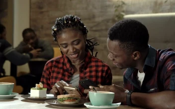 Stock Footage Young Couple Laughing At Social Media Post Free
