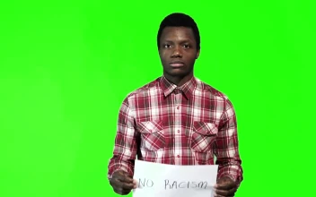 Stock Footage Young Man Holding A Sign Of No Racism Free