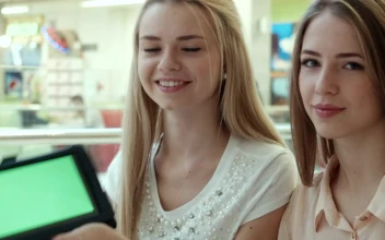Stock Footage Young Women Showing A Tablet With A Green Screen Free