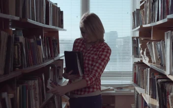 Stock Footage Young Woman Arranging The Books At The Library Free