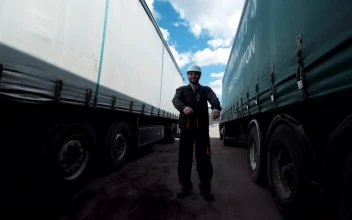Stock Footage Worker Between Two Freight Trucks Smiling Free