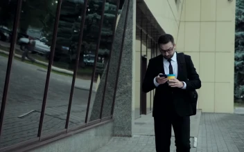 Stock Footage Young Business Man Helping Homless In The Street Free