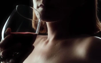 Stock Footage Woman Drinking Wine From A Glass On A Black Background Free