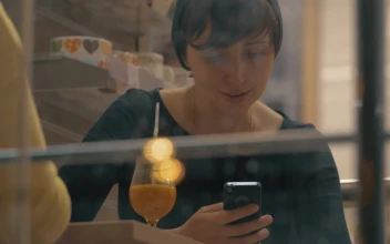 Stock Footage Woman Smiling As She Checks Her Phone Free