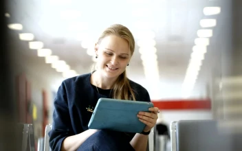 Stock Footage Woman Using A Tablet In A Waiting Room Free