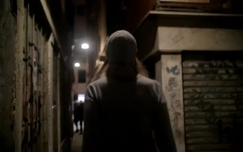 Stock Footage Woman Walking Down An Old Street Free