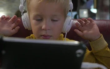 Stock Footage Young Boy Watching Cartoons On A Tablete Free